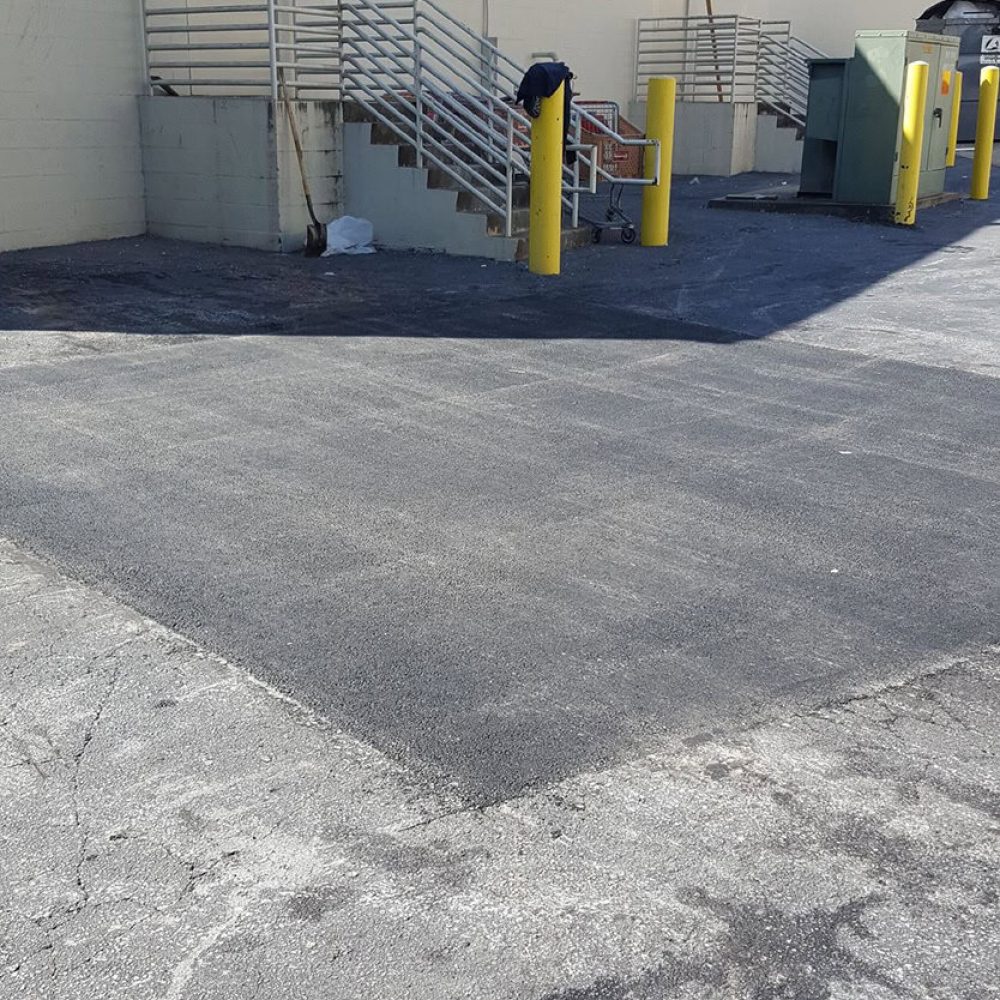 Crack filling in back of parking lot
